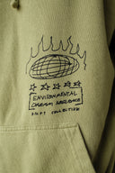 Close-up of a light olive green hoodie featuring a black hand-drawn graphic of a globe with flames, stars, and the text 'ENVIRONMENTAL DREAM SEQUENCE' and 'DRIFT COLLECTIVE'.
