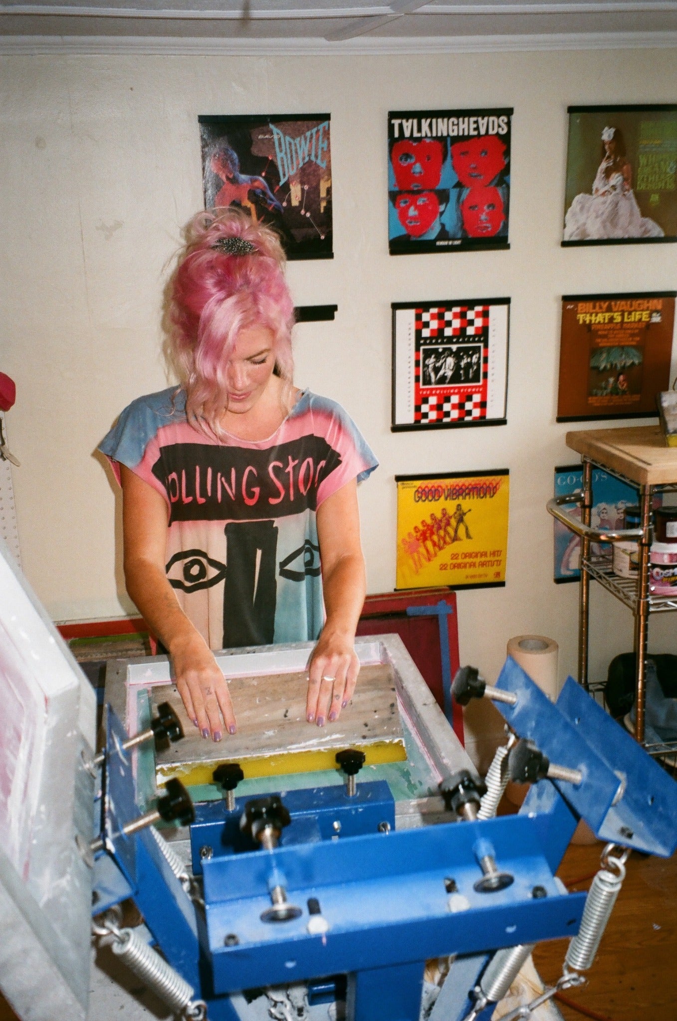 Emily screen printing a garment in the early days of The Drift Collective.